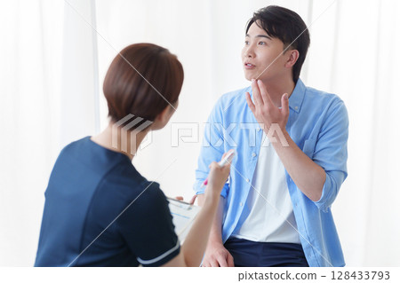 Men receiving counseling Men receiving counseling 128433793