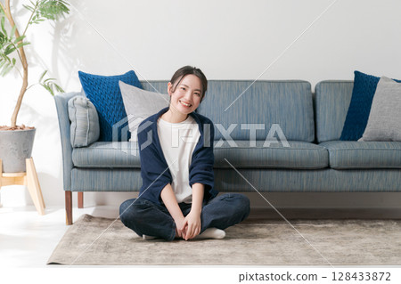 A woman relaxing at home 128433872