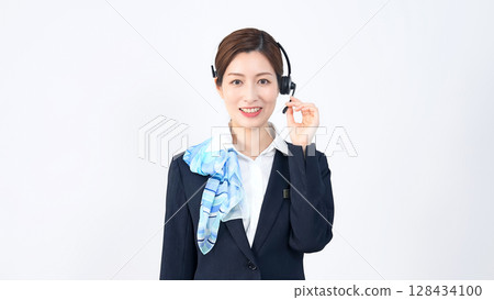 Female staff wearing a headset Female staff wearing a headset 128434100