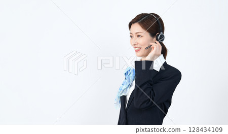 Female staff wearing a headset Female staff wearing a headset 128434109