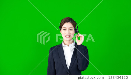 Female staff wearing a headset Female staff wearing a headset 128434120