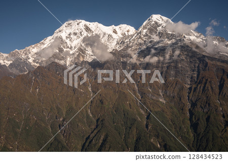 View of Mt.Annapurna South (7,219 m) and Mt.Hiunchuli (6,441 m) seen from Mardi Himal view point in the Annapurna region of Nepal.  128434523
