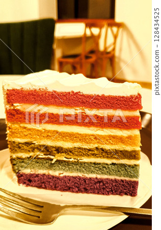 Fresh baked homemade Rainbow cake set on table. 128434525
