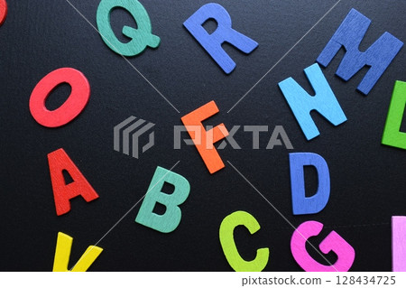 colorful letter alphabet on black background, object for education colorful letter alphabet on black background, object for education 128434725