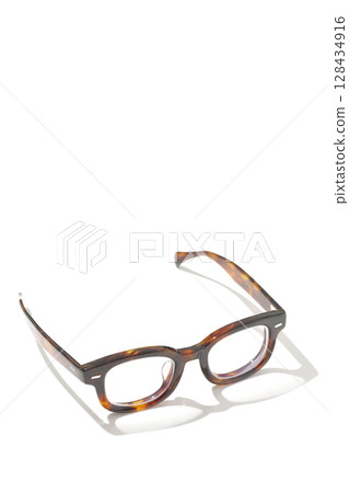 Glasses photographed on a white background Glasses photographed on a white background 128434916