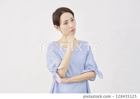 Female thinking white background Female thinking white background 128435125