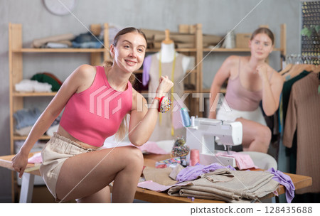 Dressmakers warming up together during a break 128435688