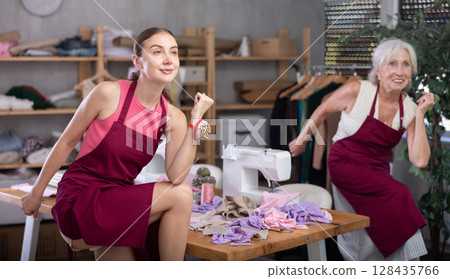 Elderly and adult women tailors are moving and doing warm-up 128435766