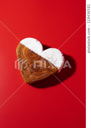 Flat lay greeting card Valentine's Day Delicious fresh croissant topped with white flavor Ganache. Creation unique heart shape bakery. Puff pastry holiday love gift present idea Flat lay greeting card Valentine's Day Delicious fresh croissant topped with white flavor Ganache. Creation unique heart shape bakery. Puff pastry holiday love gift present idea 128436581