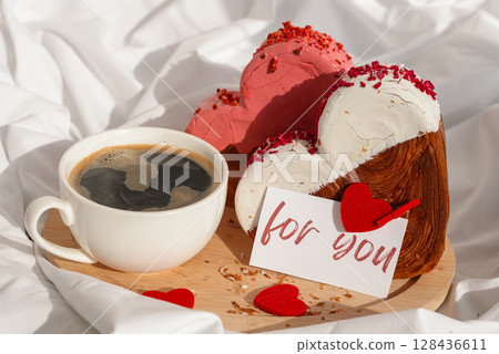 FOR YOU words paper note Morning breakfast in bed in wooden tray Present gift idea Valentine's Day Holiday celebration Heart shaped croissants. Puff pastry new trendy sweet dessert bakery. Creamy 128436611