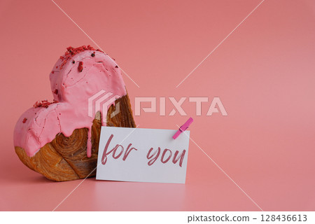 FOR YOU caption text on paper note holiday gift present Heart shaped strawberry berry croissant on pink background with copy space. Puff pastry new trendy sweet dessert bakery. Creamy dough FOR YOU caption text on paper note holiday gift present Heart shaped strawberry berry croissant on pink background with copy space. Puff pastry new trendy sweet dessert bakery. Creamy dough 128436613