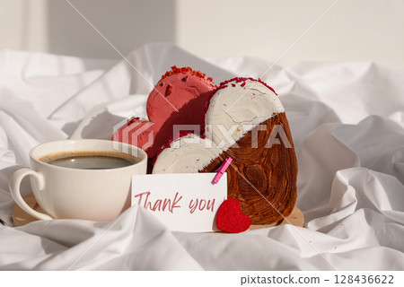 THANK YOU text message paper note card Morning breakfast Valentine's Day Birthday celebration Delicious fresh variety croissants topped with colorful flavor Ganache. Creation unique heart shape bakery 128436622