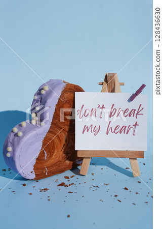 Don't break my heart pun joke saying caption on greeting card Delicious fresh croissant topped with colorful flavor Ganache. Creation unique heart shape bakery. Puff pastry holiday love gift present 128436630