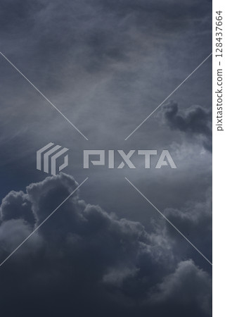 Vertical Dramatic dark storm rain clouds black sky background. Dark thunderstorm clouds rainny atmosphere. windstorm disasters climate. Dust ominous cloudscape storm disaster gloomy gray cloud sky Vertical Dramatic dark storm rain clouds black sky background. Dark thunderstorm clouds rainny atmosphere. windstorm disasters climate. Dust ominous cloudscape storm disaster gloomy gray cloud sky 128437664