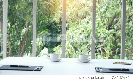 Meeting room Office laptop business financial document chart , graph on wooden table with coffee cup. Flat lay notebook computer laptop on office desk. No people business graph chart on meeting table 128437685
