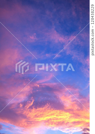 Sunset clouds 128438229