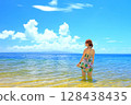 A woman looking out at the ocean at Fusaki Beach Resort, Ishigaki Island, Okinawa Prefecture 128438435