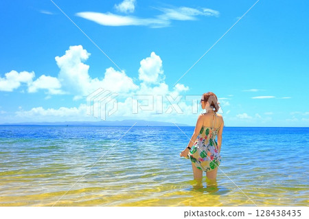 A woman looking out at the ocean at Fusaki Beach Resort, Ishigaki Island, Okinawa Prefecture 128438435