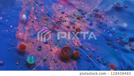 Shiny particles. Paint water. Defocused red pink blue colorful shimmer oil round liquid floating on abstract acrylic art background. 128438483