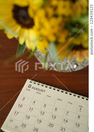 Calendar and sunflowers Calendar and sunflowers 128439125