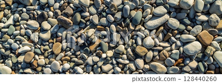 Smooth Beach Pebbles Background, Natural Texture, Seaside, Rocks, Stones. Panoramic View 128440260