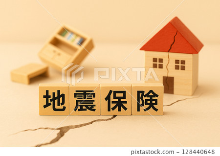 Image of earthquake insurance | A concept of preparedness expressed with a miniature house and wood blocks 128440648