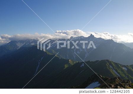 YariHotaka into sunset scene / Peaks of the Yari-Hotaka mountain range in early summer at dusk 128442105