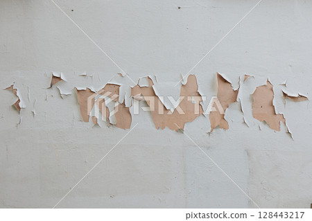 light gray concrete wall texture. Rough stone texture. Stone background. Cracked paint and plaster. 128443217
