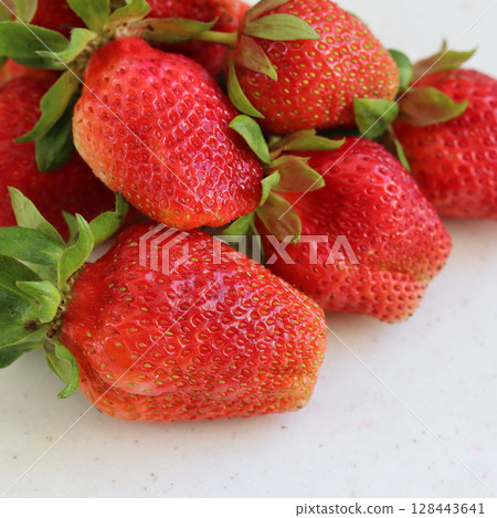Large ripe red fresh juicy strawberries on a white background 128443641