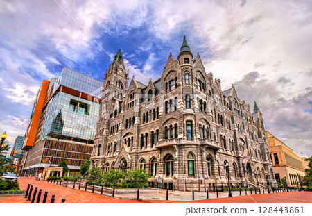 Gothic Revival-style Old City Hall in Richmond, Virginia, United States, built in 1894, juxtaposed with modern architecture and framed by a partly cloudy sky Gothic Revival-style Old City Hall in Richmond, Virginia, United States, built in 1894, juxtaposed with modern architecture and framed by a partly cloudy sky 128443861