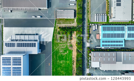 Aerial view of an industrial area lined with factories Aerial view of an industrial area lined with factories 128443993