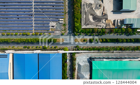 Aerial view of a factory-lined area 128444004