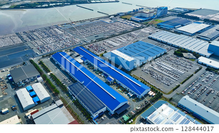 Aerial view of an industrial area lined with factories Aerial view of an industrial area lined with factories 128444017