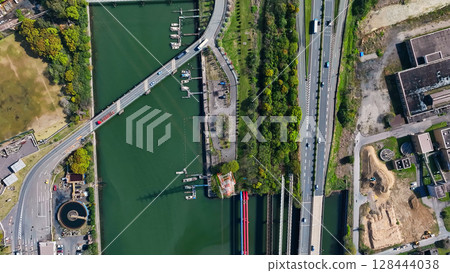 Aerial view of industrial area docks and roads 128444038