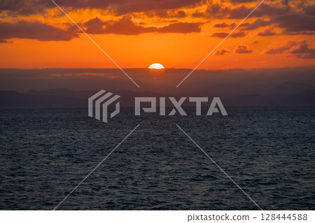 [Tokyo Kyushu Ferry bound for Mayu Shinmoji Port: Sunset off the coast of Uwajima] 128444588