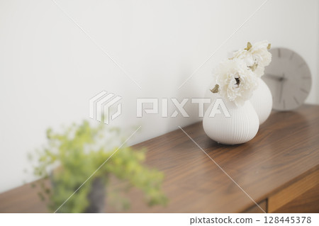Flowers placed on the window side 128445378