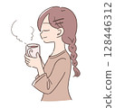 A woman relaxing with a hot drink 128446312