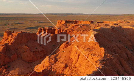 Bayanzag flaming cliffs at sunset in Mongolia Bayanzag flaming cliffs at sunset in Mongolia 128446569