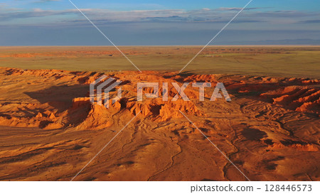 Bayanzag flaming cliffs at sunset in Mongolia Bayanzag flaming cliffs at sunset in Mongolia 128446573