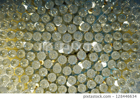 Close-Up of Glamorous Crystal Chandelier with Sparkling Details Close-Up of Glamorous Crystal Chandelier with Sparkling Details 128446634
