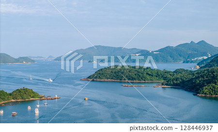 July 4 2025 coastal panorama showcasing calm waters, numerous boats, July 4 2025 coastal panorama showcasing calm waters, numerous boats, 128446937