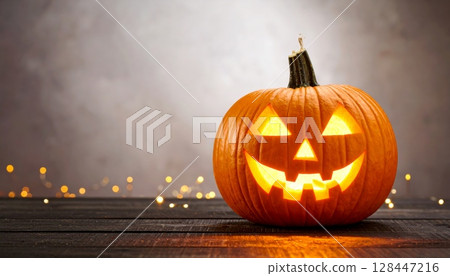 Evil face Halloween pumpkin jack-o-lantern for autumn holiday decoration 128447216
