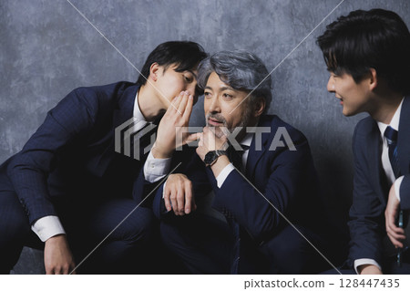 Three businessmen talking Three businessmen talking 128447435