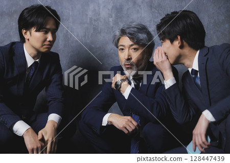Three businessmen talking 128447439