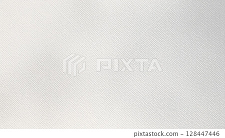 A vintage, rough paper texture provides a blank, light cream backdrop, reminiscent of old parchment or aged fabric 128447446