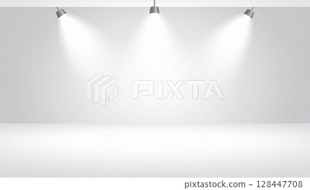 Blank, clean interior room with an empty white wall, perfect for art or product display under soft spotlights 128447708