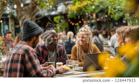 Diverse group of coworkers engaged in relaxed outdoor discussion under trees 128447915