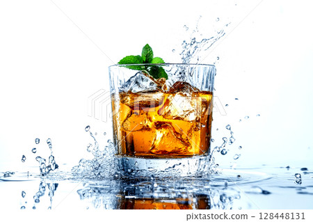 A vibrant cocktail elegantly presented in a clear glass with ice and mint splashes against a pristine white backdrop 128448131