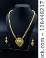 Traditional Indian Gold Necklace Set on Black Display 128448217