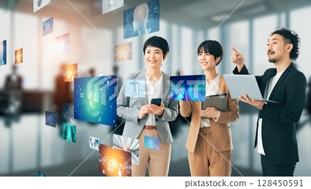 Group watching 3D images in the office Group watching 3D images in the office 128450591